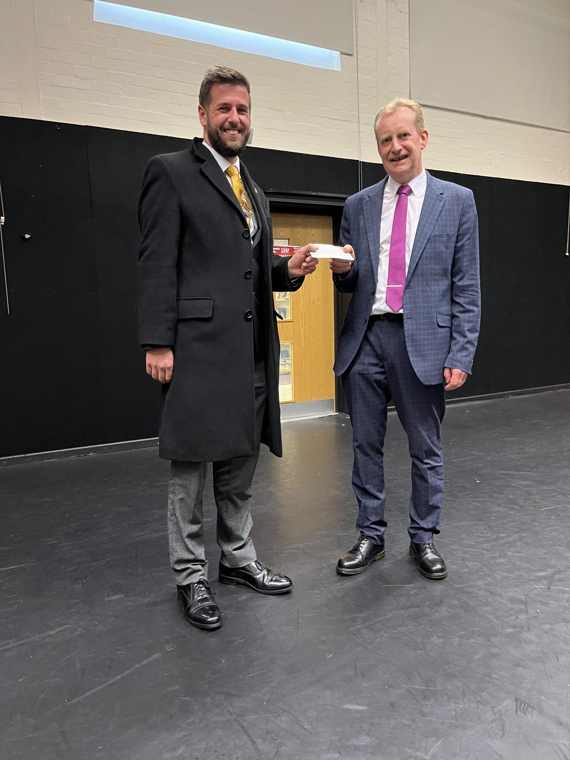 Tristan Owen of Rotary Llandudno presenting Bob Mills Award to Ysgol Aberconwy