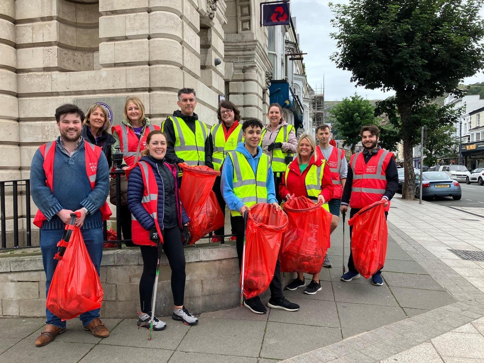 Tom Owen and Son helping clean the streets of Llandudno